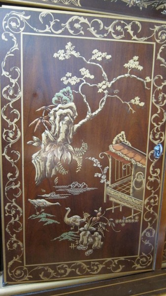 gold-painted door of oriental cabinet