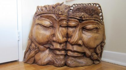 king and queen large wooden sculpture on floor
