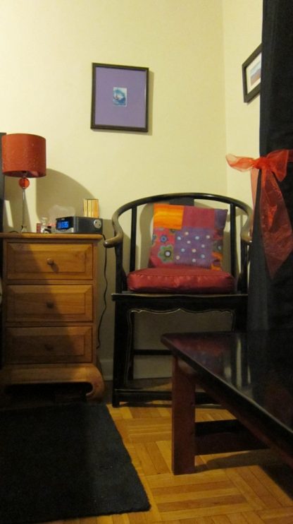 wooden oriental Ming chair in bedroom