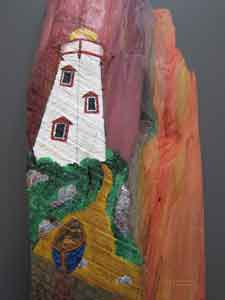 Close-up of white lighthouse painted on wood
