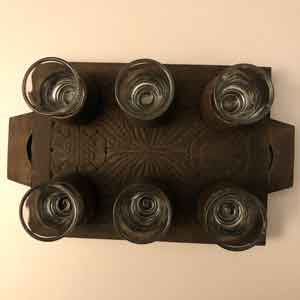 Hungarian carved wood tray with shot glasses
